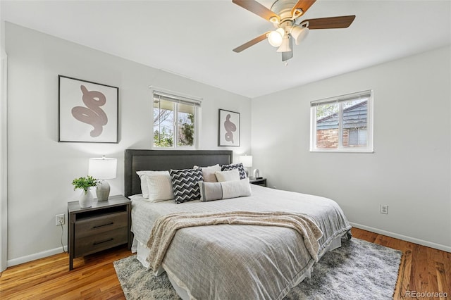 7751 S Race St, Centennial, CO 80122 - bedroom with multiple windows, baseboards, and wood finished floors