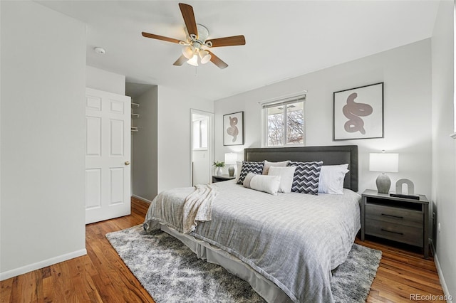 7751 S Race St, Centennial, CO 80122 - bedroom with baseboards, wood finished floors, and a ceiling fan