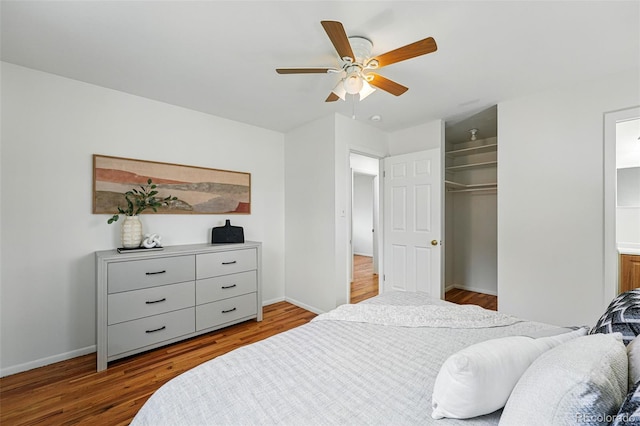 7751 S Race St, Centennial, CO 80122 - bedroom with wood finished floors, baseboards, and a ceiling fan