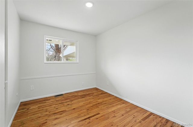 7751 S Race St, Centennial, CO 80122 - spare room with wood finished floors, baseboards, and recessed lighting