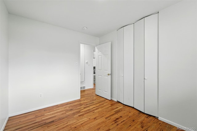 7751 S Race St, Centennial, CO 80122 - unfurnished bedroom with light wood-style floors and baseboards