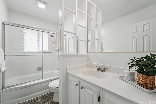 7751 S Race St, Centennial, CO 80122 - full bathroom with toilet, vanity, and shower / bath combination with glass door