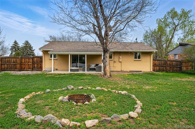 7751 S Race St, Centennial, CO 80122 - rear view of property featuring a patio area, brick siding, and an outdoor living space with a fire pit