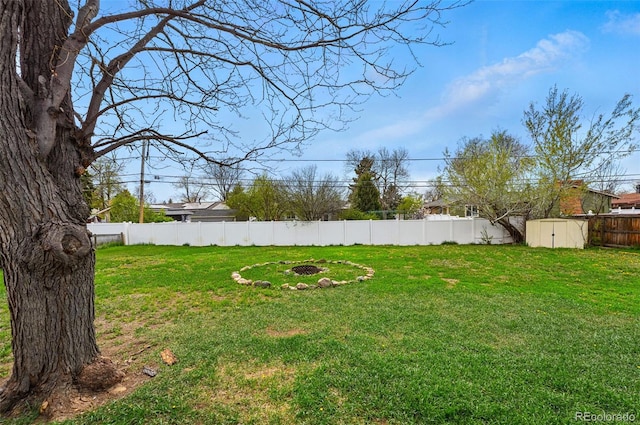 7751 S Race St, Centennial, CO 80122 - view of yard with a fire pit, a shed, and an outdoor structure
