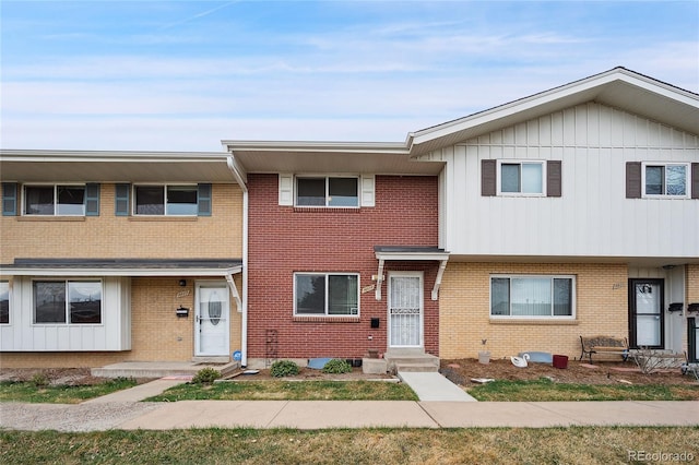 9019 E Oxford Dr, Denver, CO 80237 - townhome / multi-family property featuring brick siding and board and batten siding