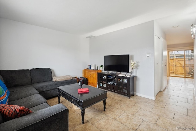 9019 E Oxford Dr, Denver, CO 80237 - living room featuring light tile patterned flooring and baseboards