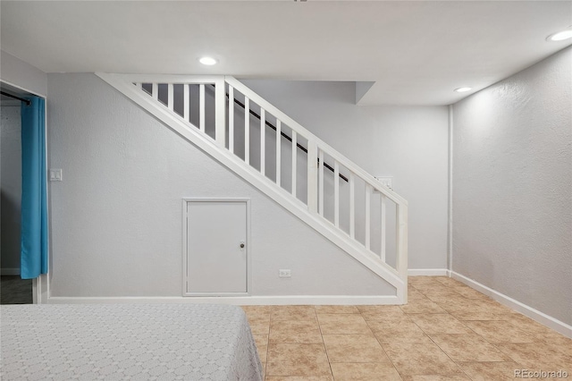 9019 E Oxford Dr, Denver, CO 80237 - stairway with recessed lighting, tile patterned flooring, and baseboards