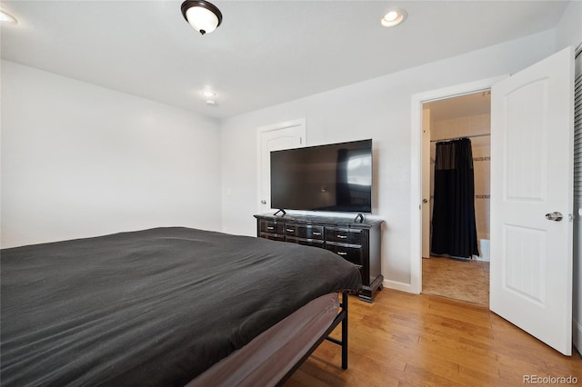 9019 E Oxford Dr, Denver, CO 80237 - bedroom featuring light wood finished floors, recessed lighting, and baseboards