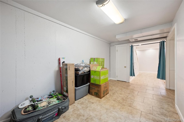 9019 E Oxford Dr, Denver, CO 80237 - below grade area featuring light tile patterned flooring