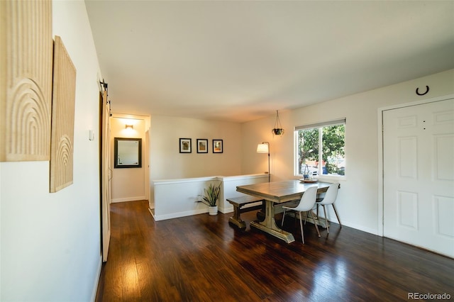 332 Maple Dr, Frederick, CO 80530 - dining space with wood finished floors and a barn door