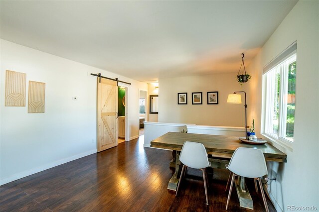 332 Maple Dr, Frederick, CO 80530 - dining space featuring a barn door and dark wood finished floors