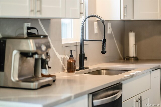 332 Maple Dr, Frederick, CO 80530 - kitchen with stainless steel dishwasher, white cabinetry, and light countertops