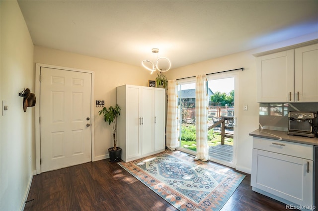 332 Maple Dr, Frederick, CO 80530 - foyer featuring dark wood-style floors and baseboards