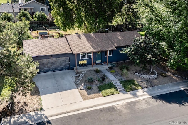 332 Maple Dr, Frederick, CO 80530 - view of front facade with a garage, roof with shingles, and driveway