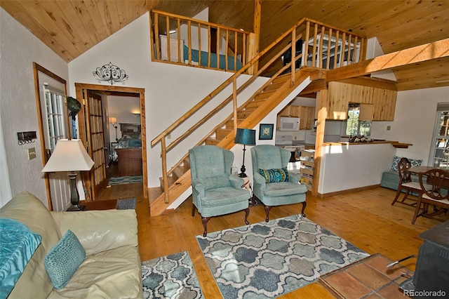 living room featuring high vaulted ceiling, wooden ceiling, and hardwood / wood-style floors