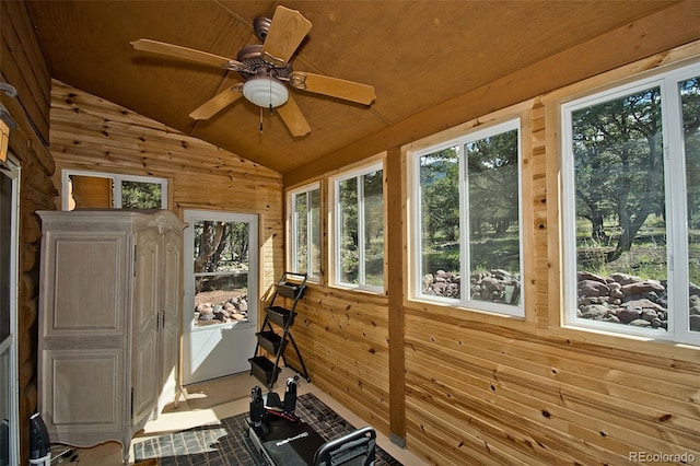 sunroom / solarium with wood ceiling, ceiling fan, and lofted ceiling