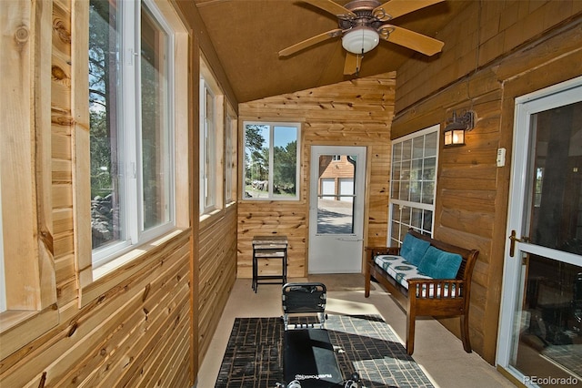 sunroom / solarium featuring lofted ceiling and ceiling fan