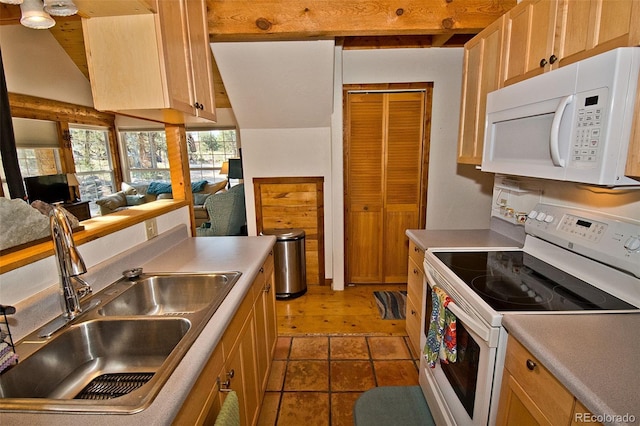 kitchen with lofted ceiling with beams, sink, light brown cabinets, and white appliances