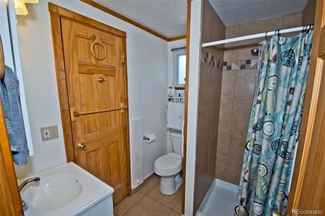 bathroom featuring crown molding, toilet, vanity, tile patterned floors, and curtained shower