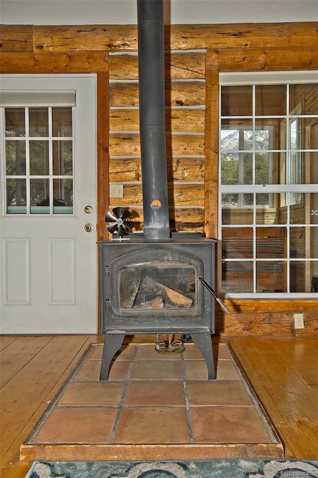 details with log walls and a wood stove