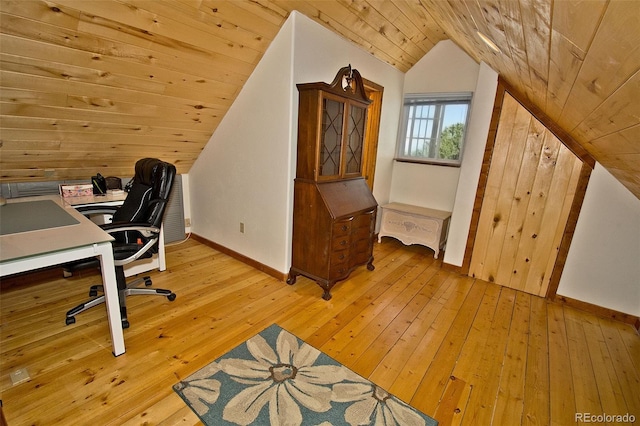 office space with baseboards, light wood-style flooring, lofted ceiling, and wood ceiling