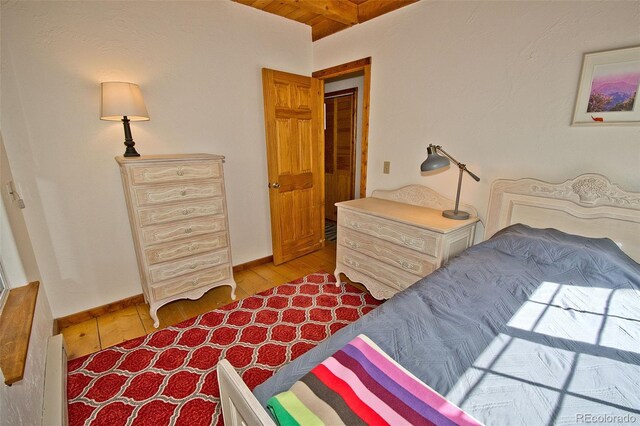 349 Chaparral Way, Crestone, CO 81131 - bedroom with light wood-style floors, baseboards, wood ceiling, and beam ceiling