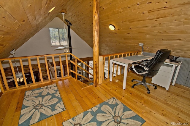 office space featuring a ceiling fan, vaulted ceiling, wooden ceiling, and hardwood / wood-style floors