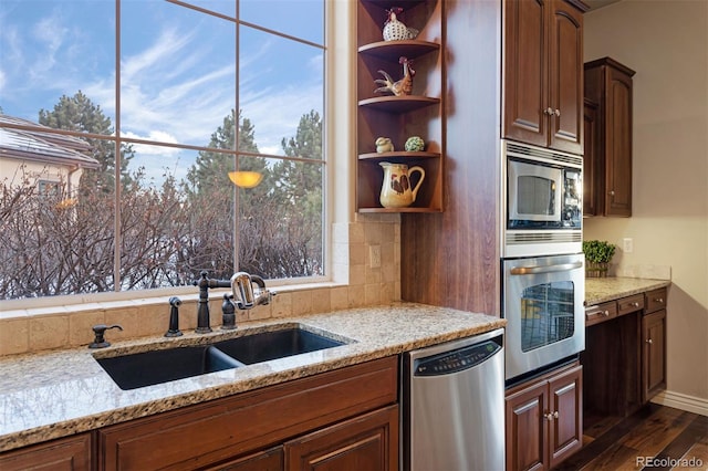 5055 Mcclure Ln, Castle Rock, CO 80108 - kitchen featuring appliances with stainless steel finishes, a sink, dark wood-style floors, tasteful backsplash, and open shelves