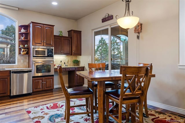 5055 Mcclure Ln, Castle Rock, CO 80108 - dining area with light wood-style floors, baseboards, and recessed lighting