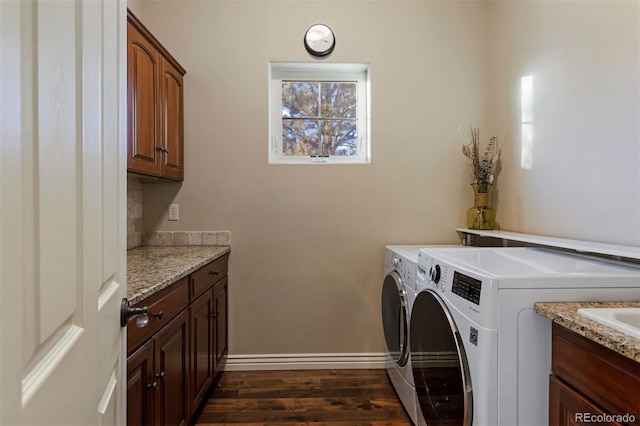 5055 Mcclure Ln, Castle Rock, CO 80108 - laundry room with independent washer and dryer, cabinet space, dark wood-style floors, and baseboards