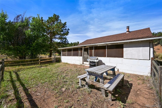 view of yard with a sunroom