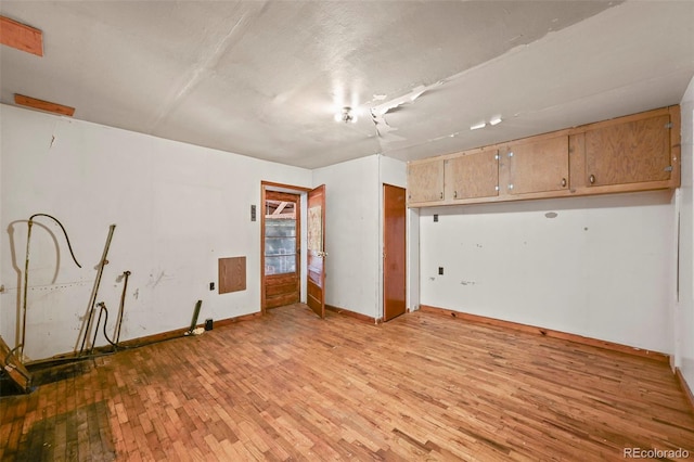 spare room featuring light hardwood / wood-style flooring