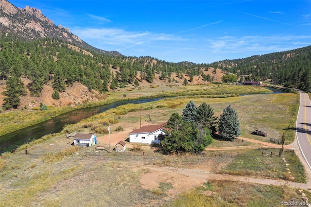 bird's eye view with a water and mountain view and a rural view