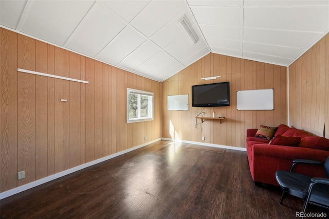 living room with lofted ceiling, wood walls, and hardwood / wood-style flooring