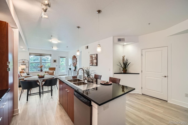 2240 N Clay St Unit 406, Denver, CO 80211 - kitchen featuring stainless steel dishwasher, dark countertops, modern cabinets, light wood-type flooring, and a center island with sink
