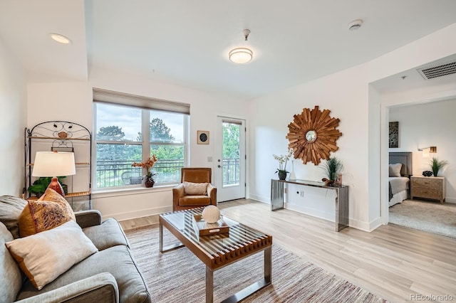 2240 N Clay St Unit 406, Denver, CO 80211 - living room with light wood-type flooring and baseboards
