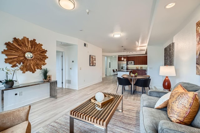 2240 N Clay St Unit 406, Denver, CO 80211 - living area with light wood-type flooring and baseboards