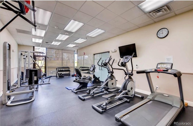 2240 N Clay St Unit 406, Denver, CO 80211 - exercise room with a paneled ceiling and baseboards