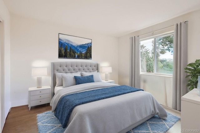 bedroom featuring wood finished floors