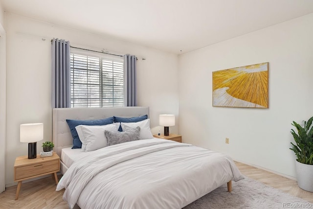 bedroom featuring light wood finished floors