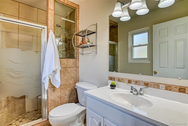 6486 Hawkeye Cir, Colorado Springs, CO 80919 - full bathroom featuring toilet, a stall shower, and vanity