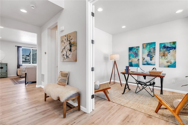 821 Boulder Peak Ave, Erie, CO 80516 - living area featuring light wood finished floors, an office area, baseboards, and recessed lighting