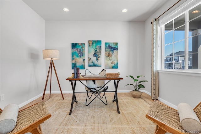 821 Boulder Peak Ave, Erie, CO 80516 - home office featuring baseboards, wood finished floors, and recessed lighting