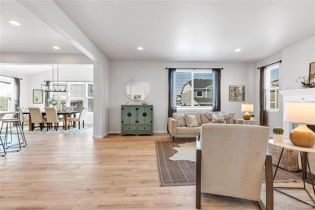 821 Boulder Peak Ave, Erie, CO 80516 - living area featuring light wood-style floors, recessed lighting, and baseboards