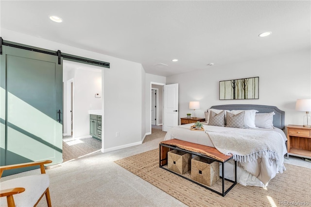 821 Boulder Peak Ave, Erie, CO 80516 - bedroom with a barn door, carpet flooring, recessed lighting, baseboards, and connected bathroom