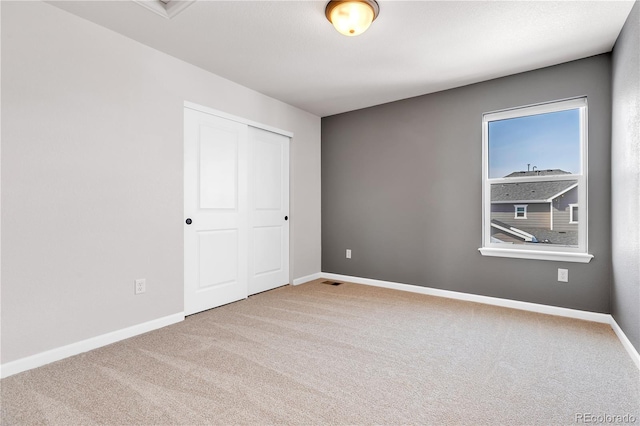 821 Boulder Peak Ave, Erie, CO 80516 - spare room featuring carpet floors and baseboards