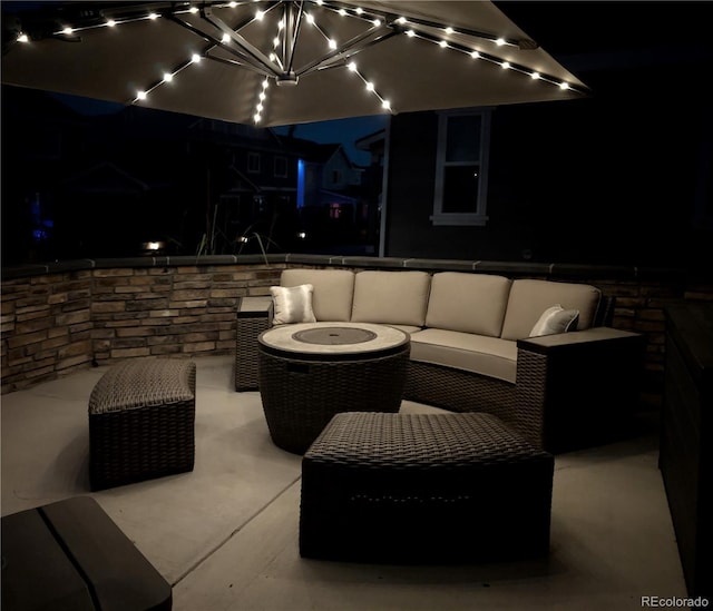 821 Boulder Peak Ave, Erie, CO 80516 - patio at twilight featuring an outdoor hangout area