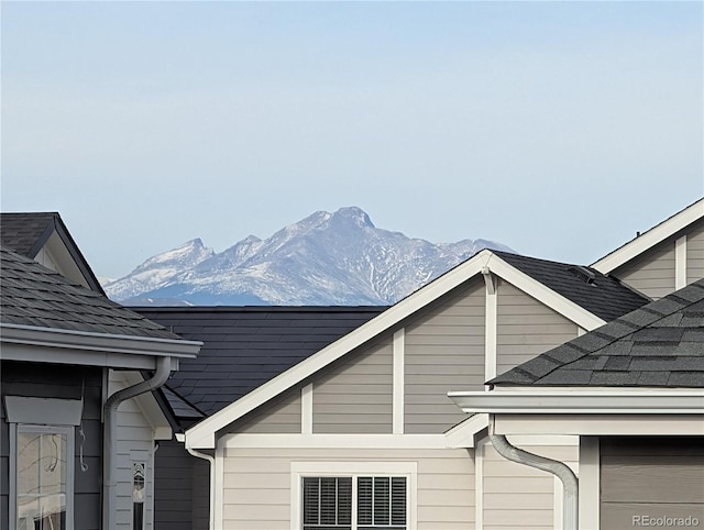 821 Boulder Peak Ave, Erie, CO 80516 - view of side of home with a mountain view and roof with shingles