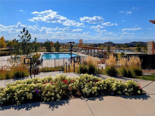 821 Boulder Peak Ave, Erie, CO 80516 - community pool with fence and a water view