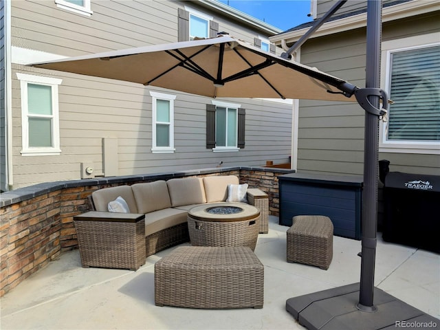 821 Boulder Peak Ave, Erie, CO 80516 - view of patio with an outdoor living space with a fire pit